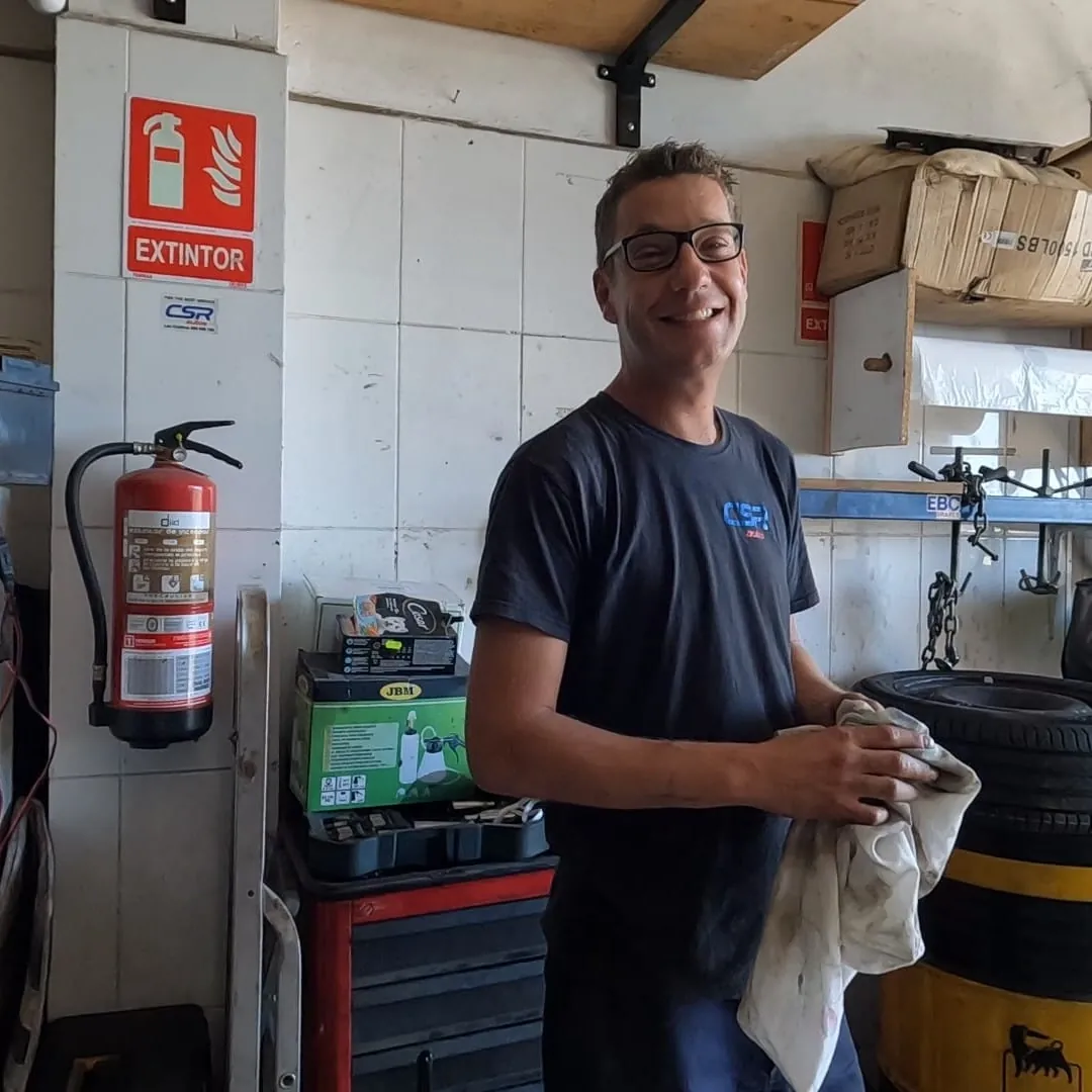 Charlie smiling inside the CSR Autos garage.